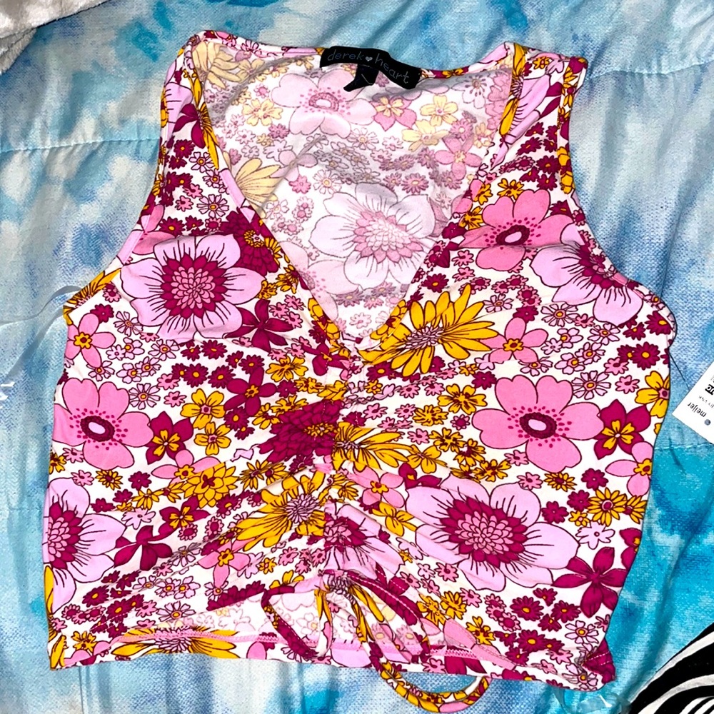 New never used tank top. Colorful and a perfect top for jeans or flare pants